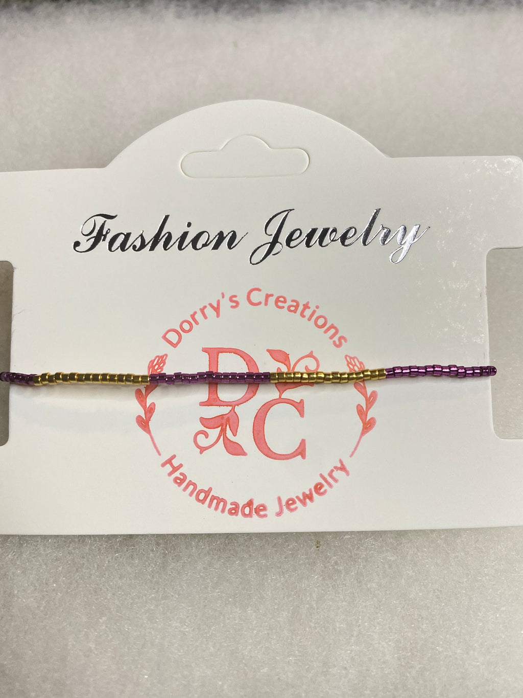 Dainty Purple and Gold Bead Bracelet with gold bead accent