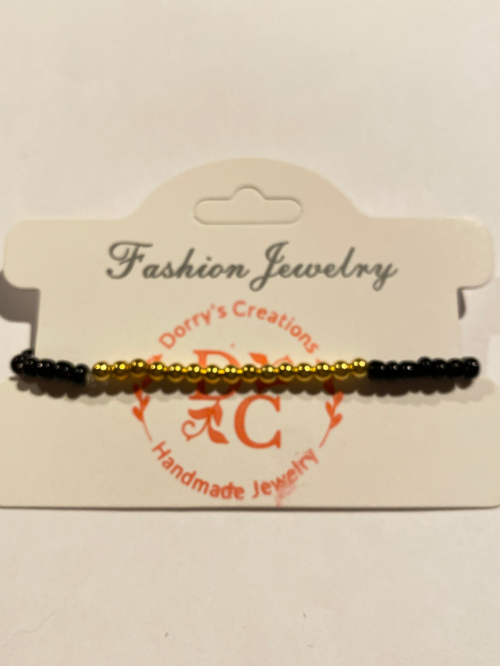 Stretch Bead Bracelet Black and Gold can be worn alone or together with others