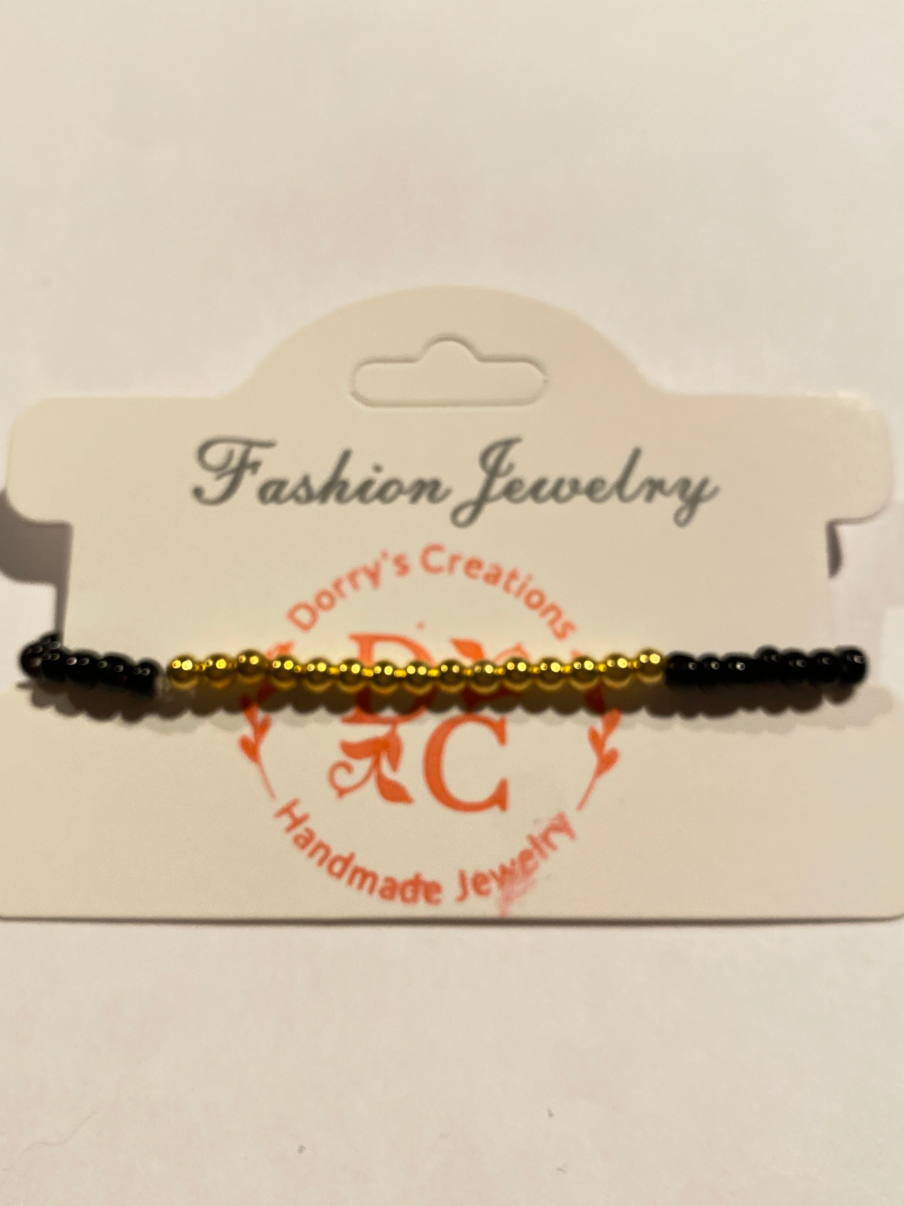 Stretch Bead Bracelet Black and Gold can be worn alone or together with others